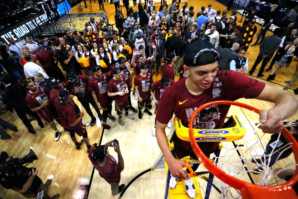Lucas Williamson of the Loyola Ramblers celebrates by cutting down the net after defeating the Kansas State Wildcats during the 2018 NCAA Men’s Basketball Tournament South Regional at Philips Arena on March 24, 2018 in Atlanta, Georgia. Loyola defeated Kansas State 78-62 to advance to the Final Four.