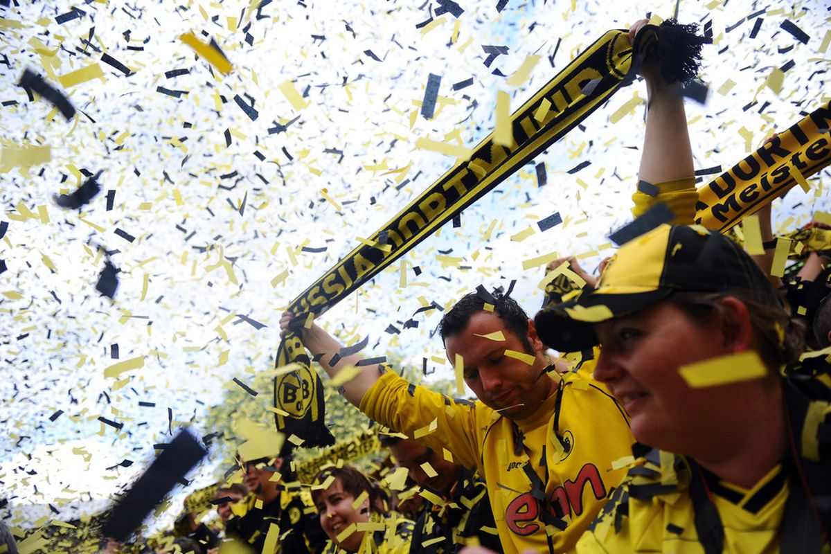 DORTMUND, GERMANY - MAY 15: Fans of Dortmund celebrate during the Borussia Dortmund Bundesliga winners parade at Westfalenhalle on May 15, 2011 in Dortmund, Germany.  (Photo by Lars Baron/Bongarts/Getty Images)