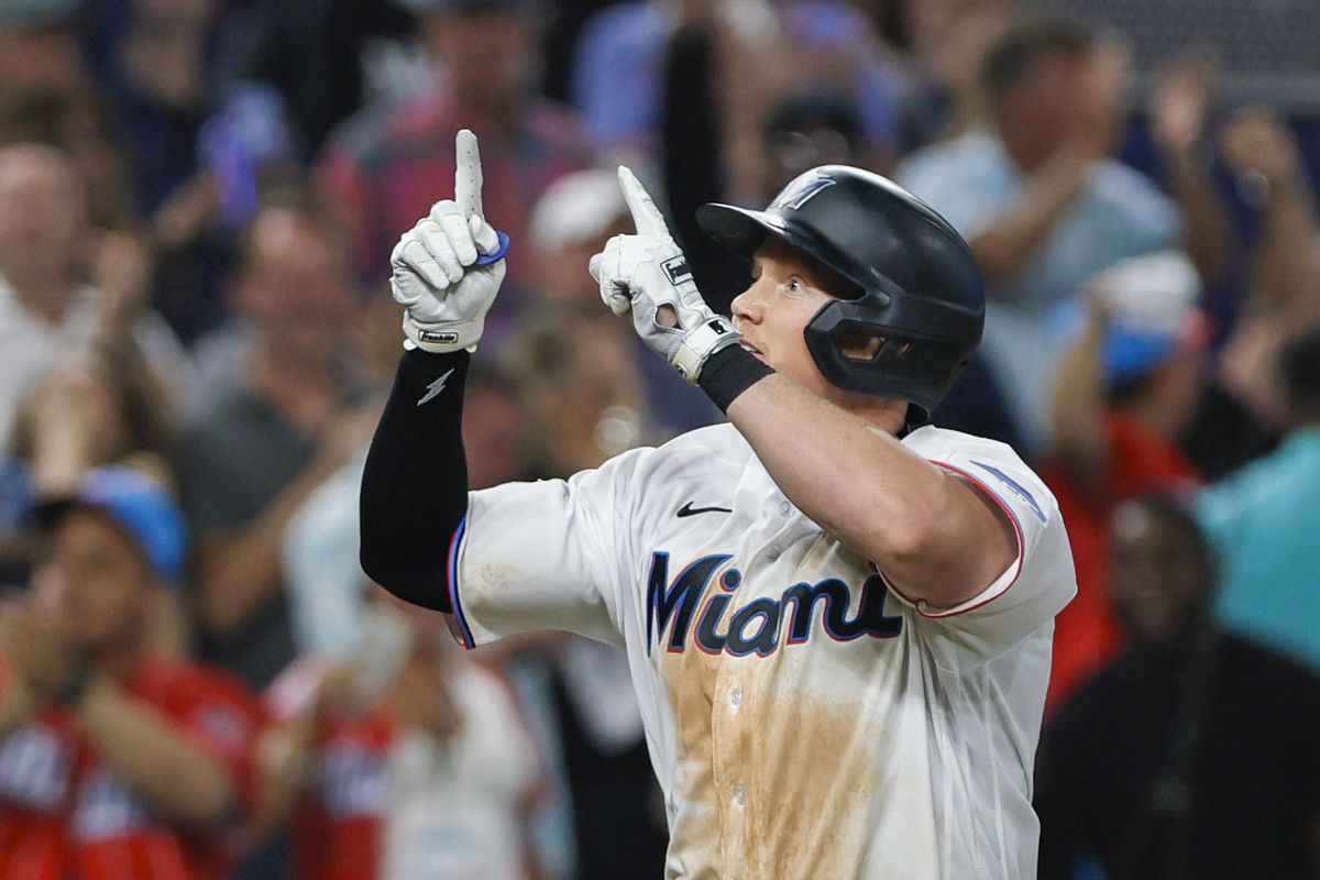 Miami Marlins first baseman Garrett Cooper (26) reacts on his way to home plate after hitting a two-run home run during the sixth inning against the New York Mets at loanDepot Park.