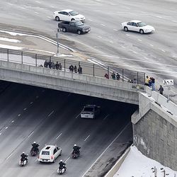 The procession heads toward Spanish Fork following funeral services for Utah County Sheriff's Sgt. Cory Wride Wednesday, Feb. 5, 2014.