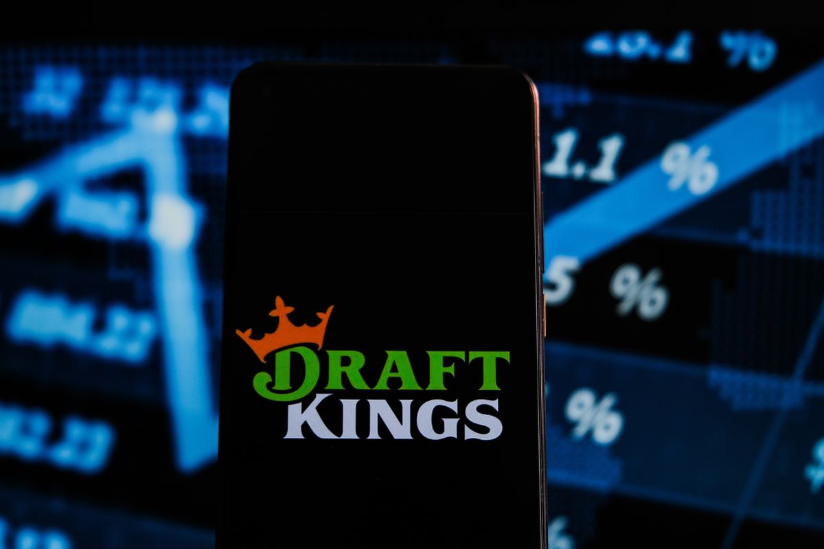 In this photo illustration a Draft Kings logo displayed on a...