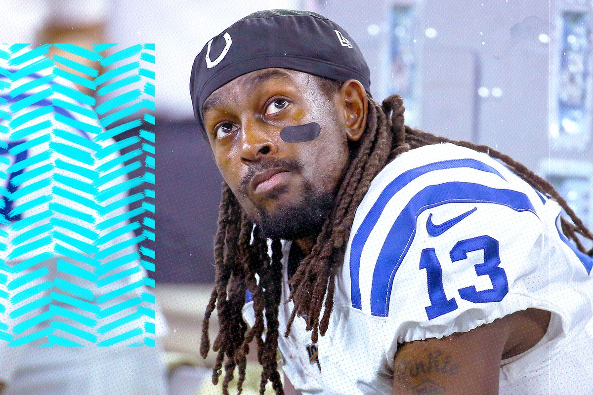 Colts WR TY Hilton sits on the bench, looking up with a sad look on his face