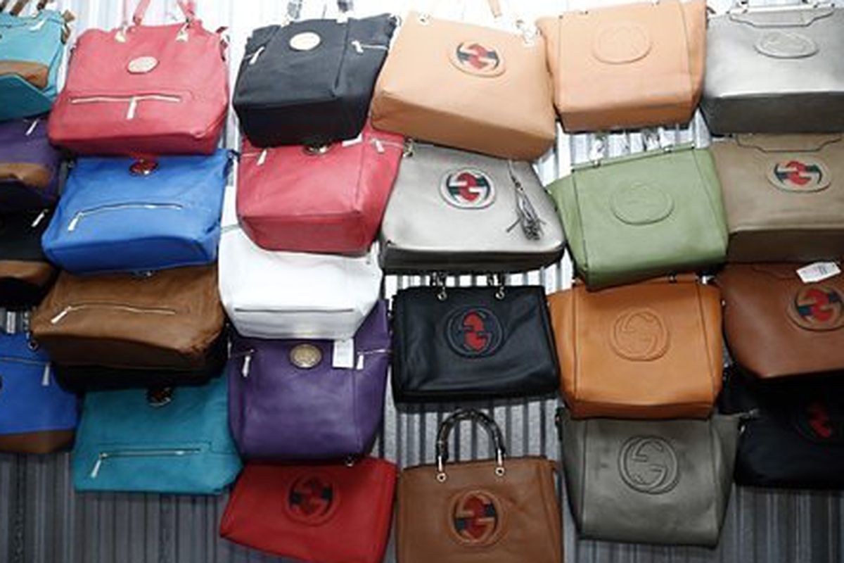 Counterfeit purses seized at a raid in Queens earlier this month. Photo: <a href="http://www.wwd.com/business-news/government-trade/nypd-nabs-22m-in-counterfeit-goods-8066448">WWD</a>