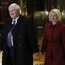 Former House Speaker Newt Gingrich and his wife Callista Gingrich walk to talk with media at Trump Tower, Monday, Nov. 21, 2016, in New York after meeting with President-elect Donald Trump. 