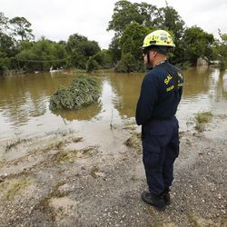 Utah Task Force 1 member Mike White waits for searchers during Tropical Storm Harvey in Houston on Wednesday, Aug. 30, 2017.