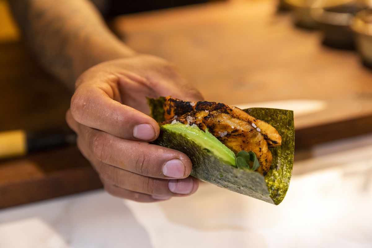A nori-wrapped taco with avocado.