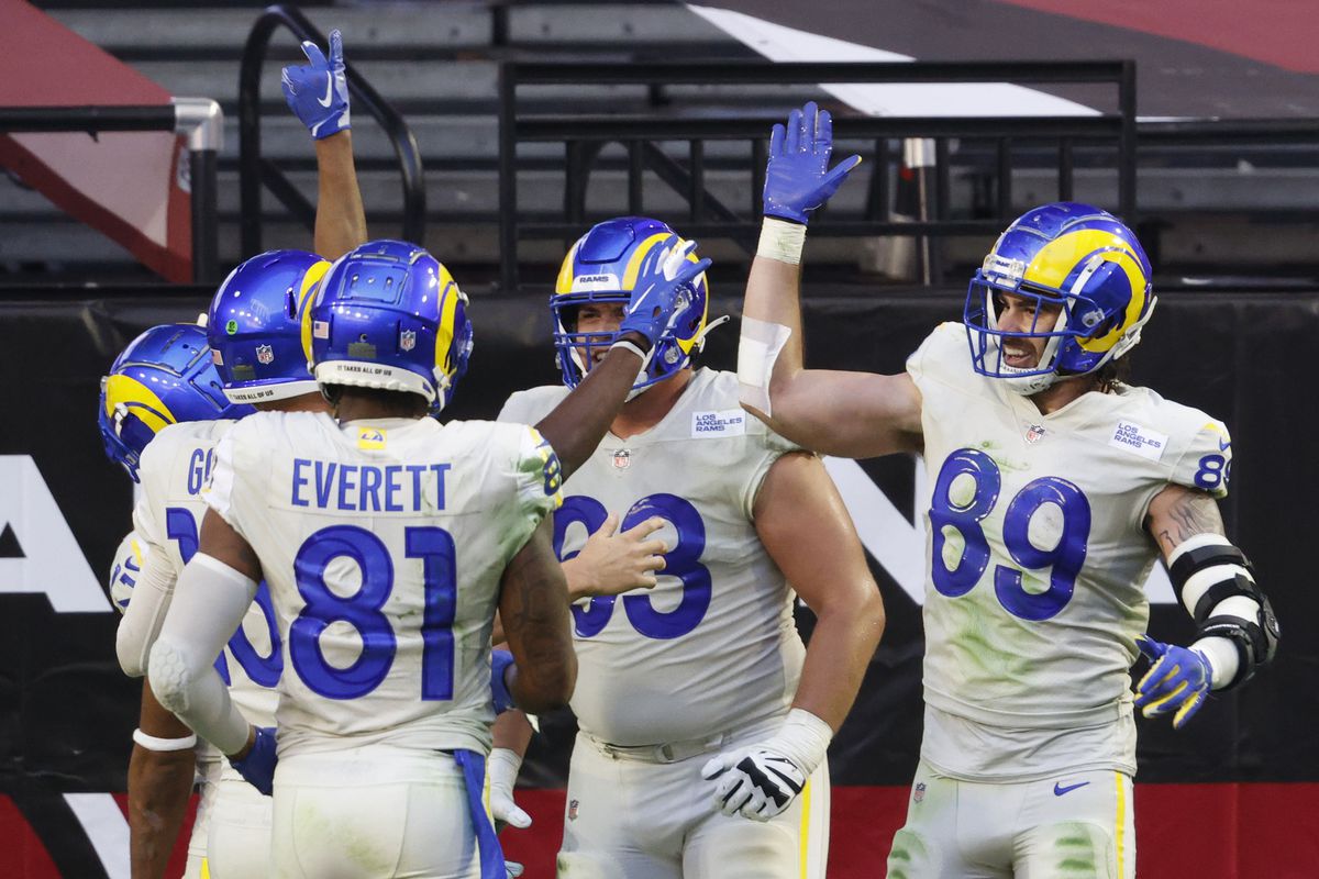 Tyler Higbee #89 of the Los Angeles Rams celebrates a touchdown with teammates during the first half against the Arizona Cardinals at State Farm Stadium on December 06, 2020 in Glendale, Arizona.