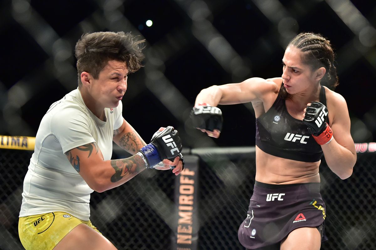 Ariane Lipski (red gloves) fights Isabela De Pauda (blue gloves) during UFC Fight Night at Ginsasio do Ibirapuera