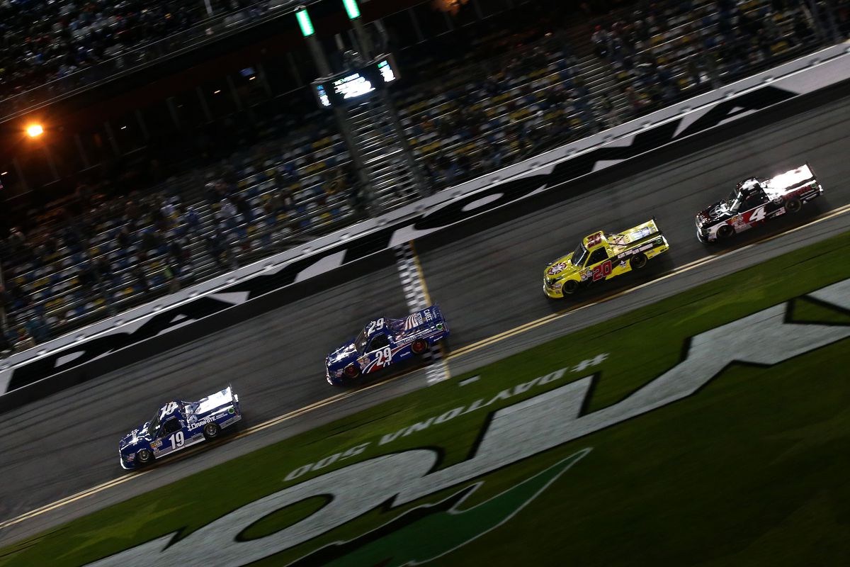 Tyler Reddick, driver of the #19 DrawTite Ford, leads a pack of trucks during the NASCAR Camping World Truck Series NextEra Energy Resources 250 at Daytona International Speedway on February 20, 2015 in Daytona Beach, Florida.