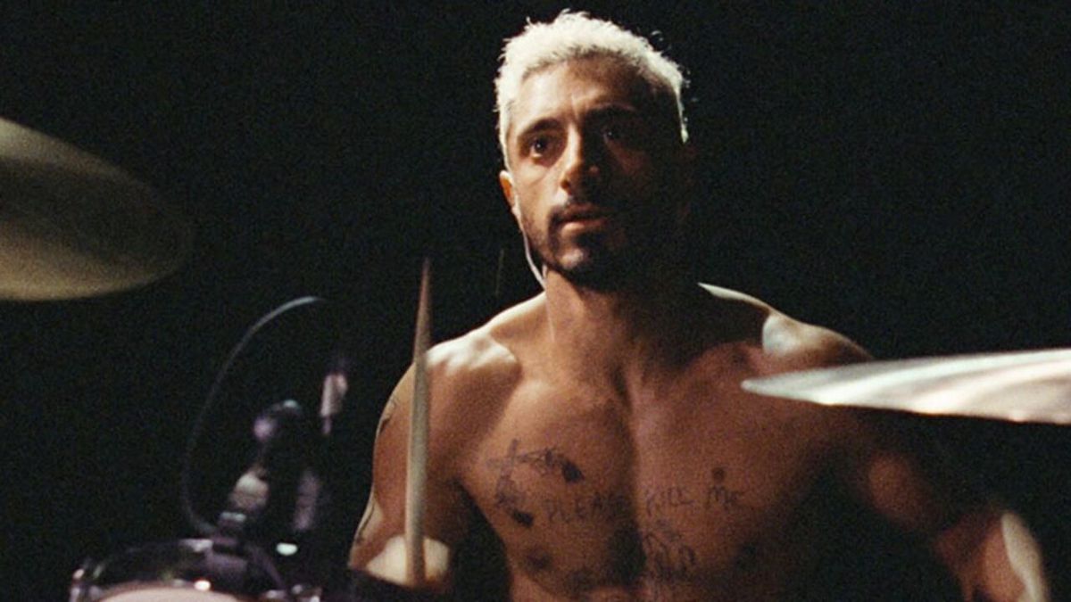 Riz Ahmed shirtless and drumming in Sound of Metal