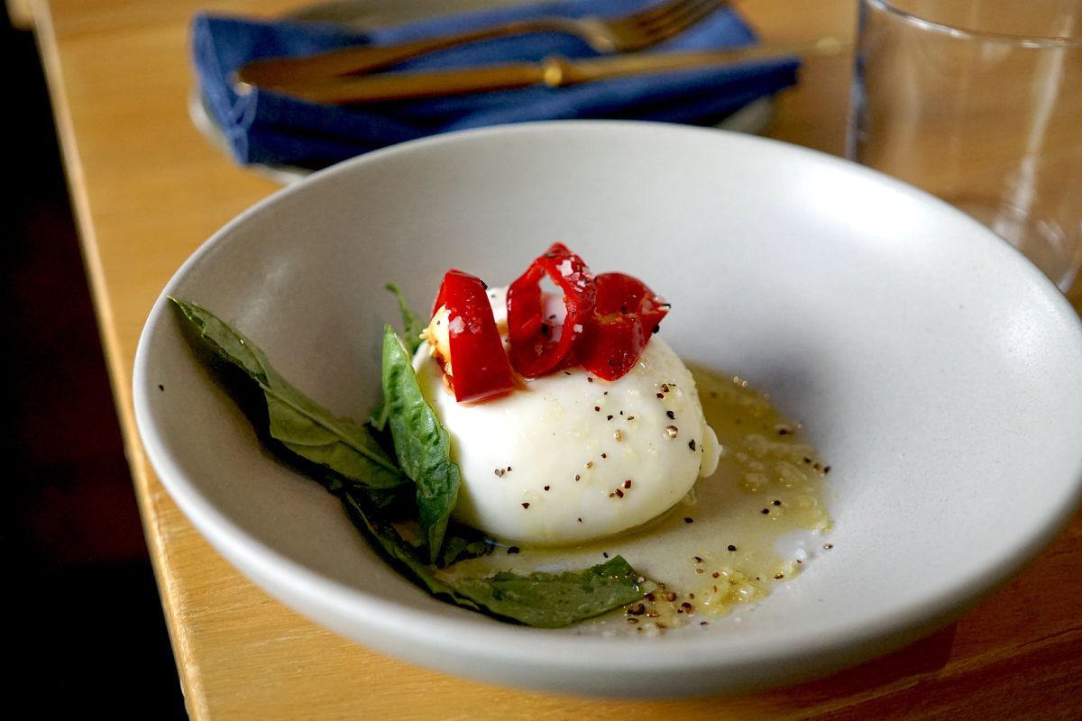 Burrata with basil and pickled Fresno chiles.
