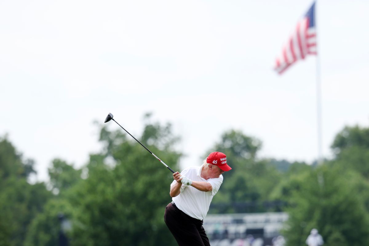 Former U.S. President Donald Trump plays his shot from the ninth tee during the pro-am prior to the LIV Golf Invitational - Bedminster at Trump National Golf Club Bedminster on July 28, 2022 in Bedminster, New Jersey.