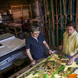 Tom Holdman, right, and his son, Thomas Holdman Jr., assemble an art glass panel that will be part of “The Roots of Knowledge,” a 200-foot-long stained glass installation for Utah Valley University, at Holdman Studios in Lehi on Friday, Nov. 4, 2016. The university announced a $1.5 million donation from philanthropists Marc and Deborah Bingham that will enable the completion of the massive stained glass installation.