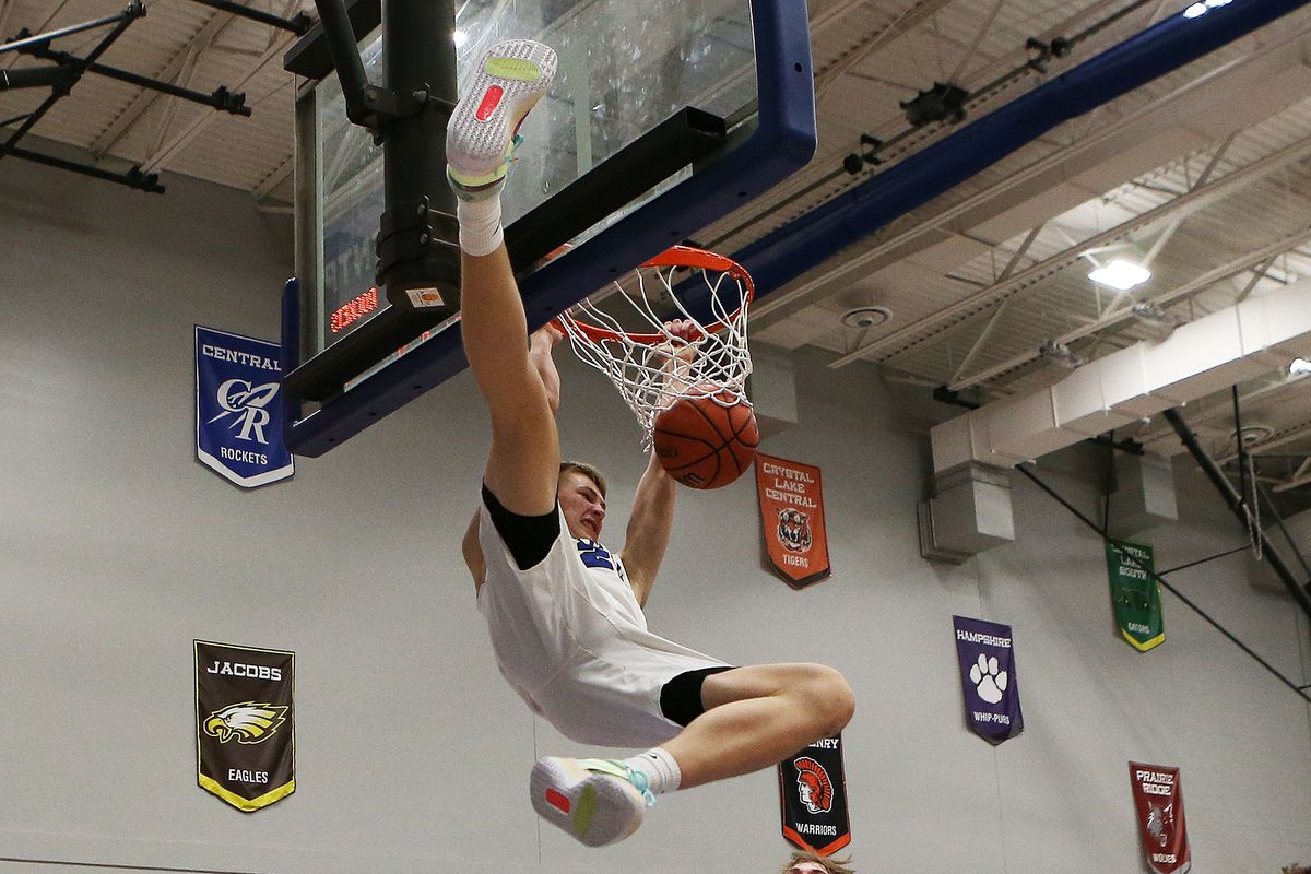 Burlington Central’s Andrew Scharnowski dunks in the first half of a win against Jacobs.