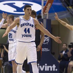 Brigham Young players Nick Emery (4), Kyle Davis (21), Corbin Kaufusi (44), and Chase Fischer (1) celebrate after a play in the first half of their matchup against Pepperdine at the Marriott Center in Provo, Saturday, Jan. 30, 2016. 
