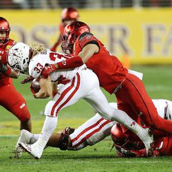 Utah Utes linebacker Kavika Luafatasaga (55) brings down Indiana Hoosiers running back Ricky Brookins (33) as the Utes and the Hoosiers play in the Foster Farms Bowl in Santa Clara, California on Wednesday, Dec. 28, 2016.