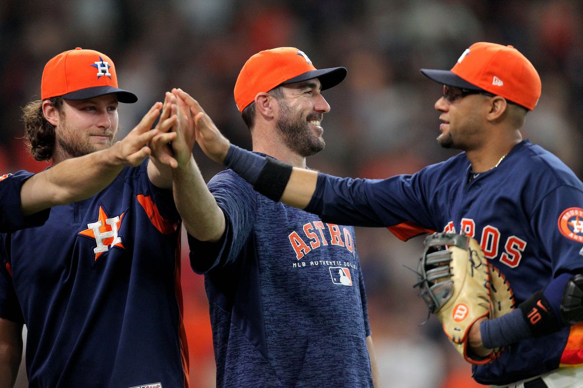 Houston Astros starting pitcher Gerrit Cole starting pitcher Justin Verlander and first baseman Yuli Gurriel celebrate the final out of Houston’s 2-1 win over the Chicago White Sox at Minute Maid Park.