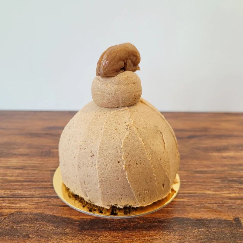 small dome dessert topped with chestnut