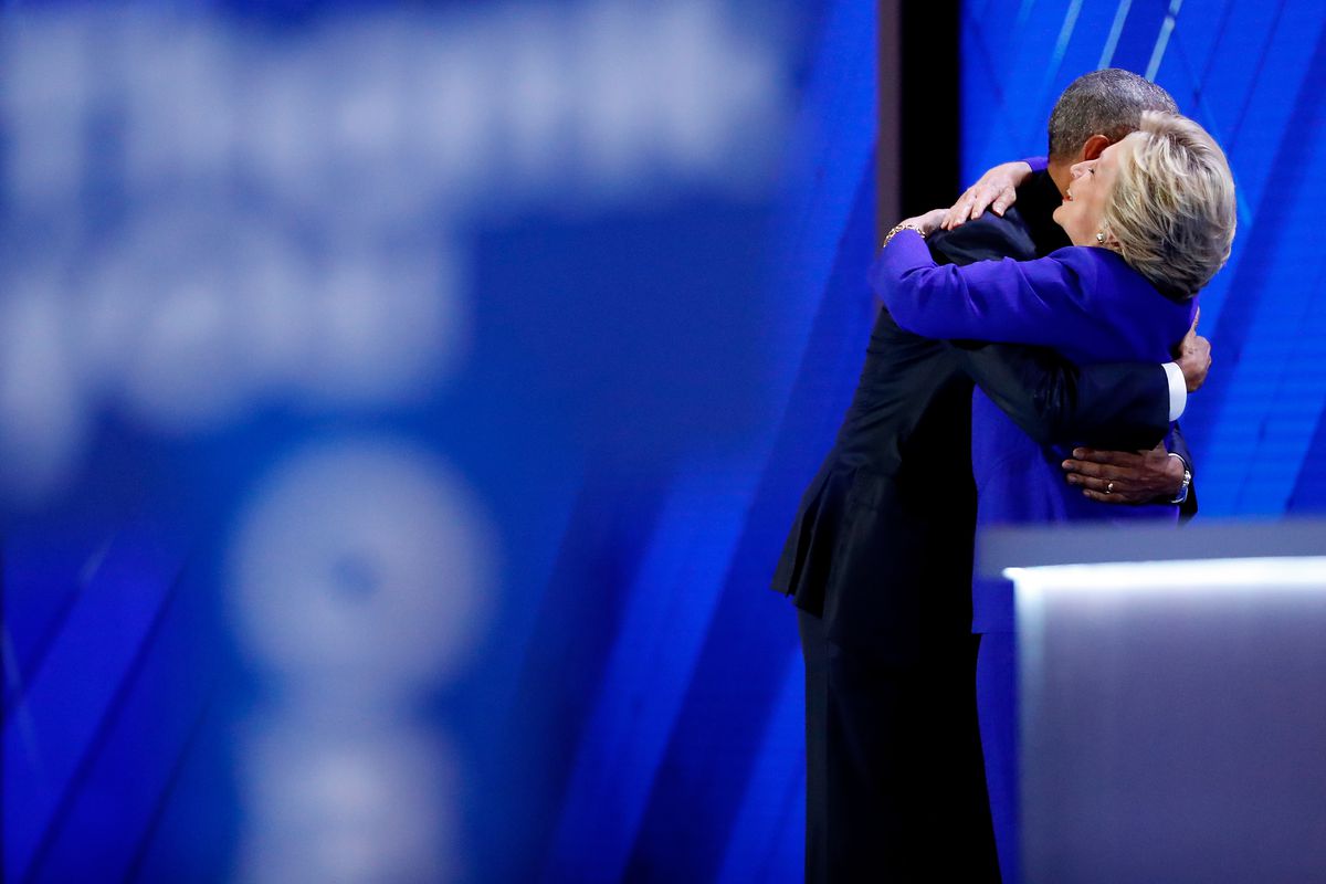 Hillary Clinton and Barack Obama embrace at the end of Obama’s speech.