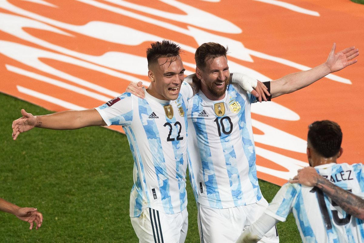 Lautaro Martinez (left) celebrates a goal with Lionel Messi...