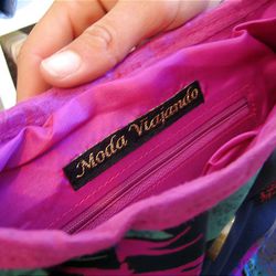 The Moda Viajando label is sewn in the handbag designs of Ally Losness shown at her home studio in San Clemente, California. Her designs are inspired by her travels around the globe with her pro surfer husband.