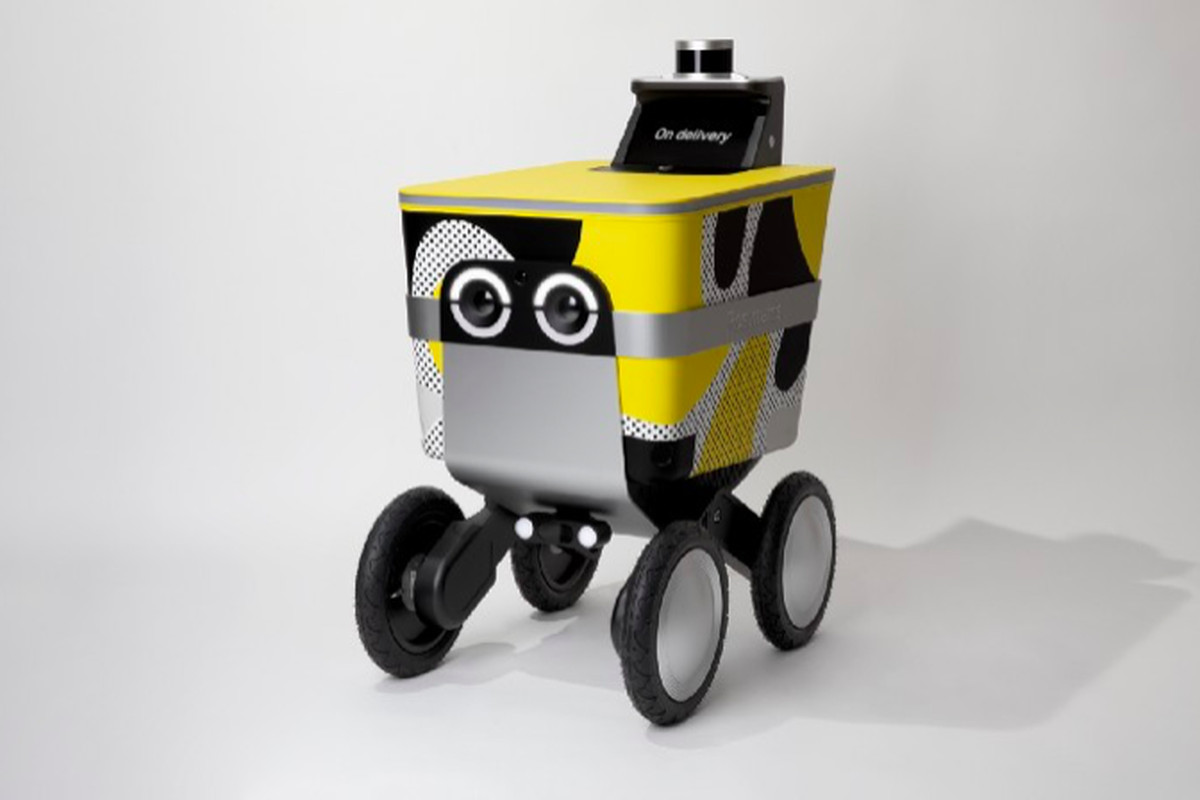 A boxy yellow delivery robot with circular eyes on the front.