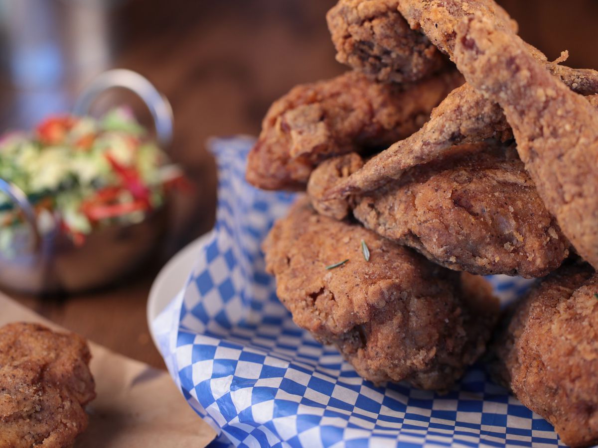 Gluten-free fried chicken on a platter with a side