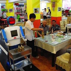 <span class="credit"><em>[Photo: <a href="http://www.dailymail.co.uk/sciencetech/article-2165339/Serving-humanity-diner-time-Chinese-restaurant-robot-staff-delights-noodle-lovers.html">Rex Features</a>]</em></span>