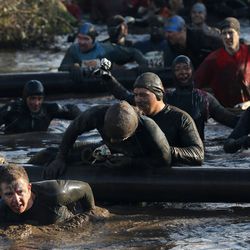 competitors in action during the Tough Guy Challenge on January 27, 2013 in Telford, England.