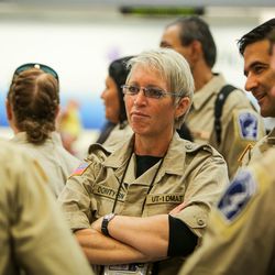 Sheryl Dority, a member of the Utah's Disaster Medical Assistance Team, listens to a fellow team member before departing the Salt Lake City International Airport for Texas on Tuesday, Aug. 29, 2017. The team's 36 members, who will aid in relief efforts, consist of physicians, nurses, paramedics, emergency medical technicians and other medical specialists.