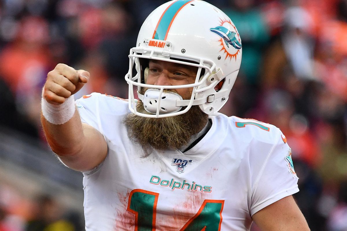 Quarterback Ryan Fitzpatrick of the Miami Dolphins celebrates after scoring a touchdown against the Cleveland Browns at FirstEnergy Stadium on November 24, 2019 in Cleveland, Ohio.