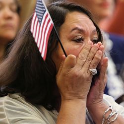 Blance Zepata wipes away tears after becoming a U.S. citizen at This Is the Place Heritage Park on Thursday, Sept. 17, 2015, in Salt Lake City.  
