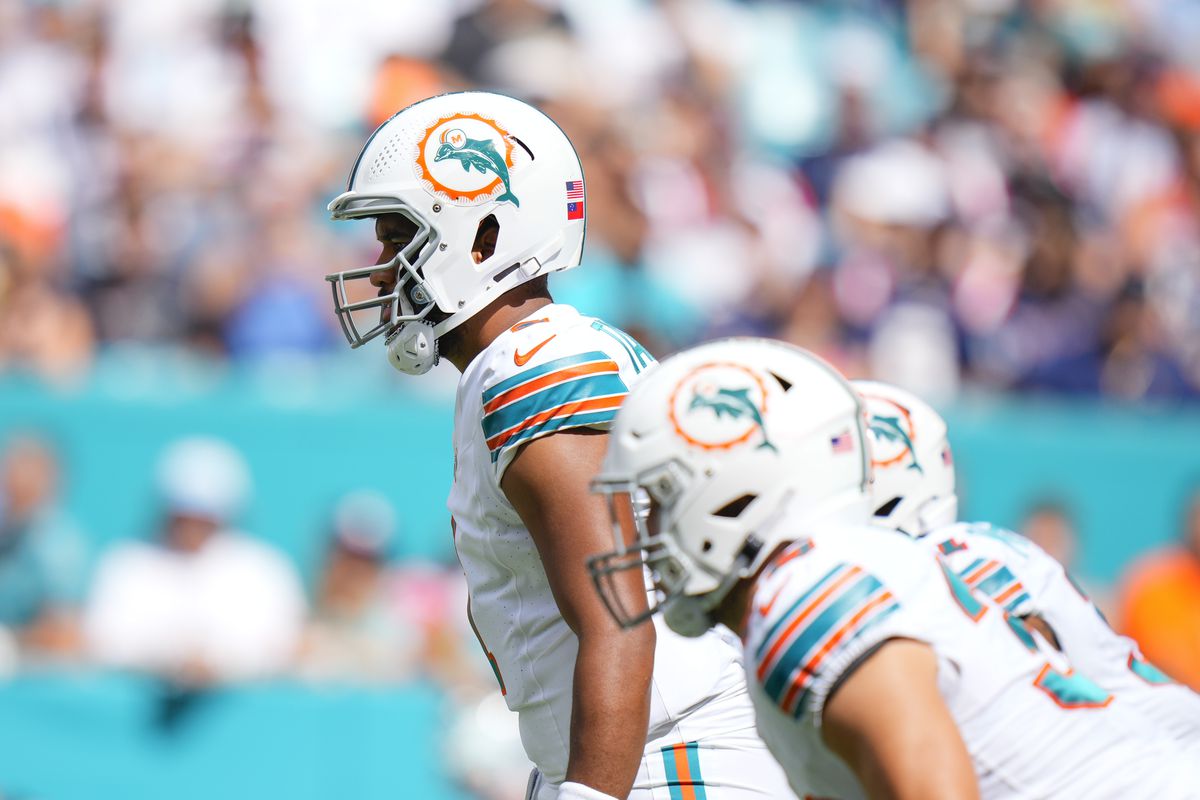 Tua Tagovailoa #1 of the Miami Dolphins looks on against the New England Patriots during the first half at Hard Rock Stadium on October 29, 2023 in Miami Gardens, Florida.