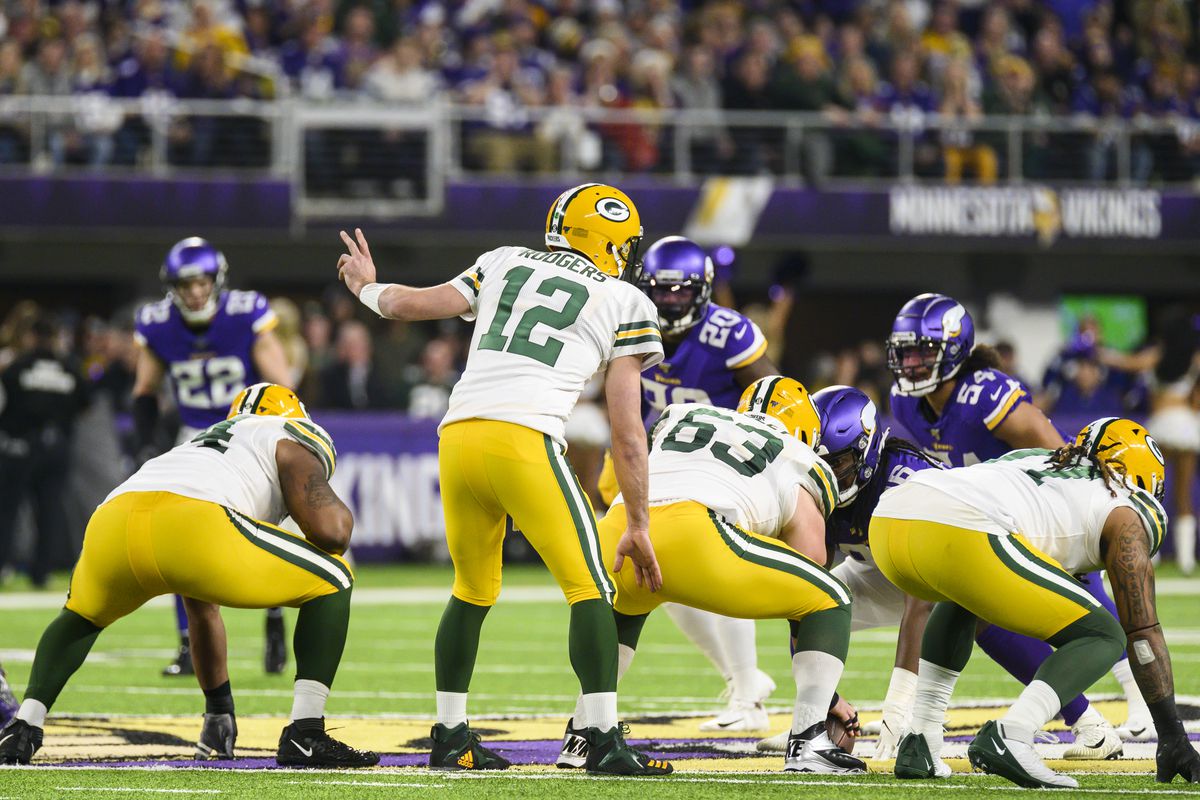 Aaron Rodgers of the Green Bay Packers gestures at the line of scrimmage in the first quarter of the game against the Minnesota Vikings at U.S. Bank Stadium on December 23, 2019 in Minneapolis, Minnesota.