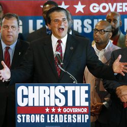 N.J. Gov. Chris Christie, left,  gets the endorsement of Essex County Executive Joe DiVincenzo at McLoone’s Boat House in West Orange, N.J., Tuesday, June 11, 2013. DiVincenzo is the latest in a line of elected Democrat to endorse the Republican governor's re-election bid, N.J. Looking on at right is Essex County Sheriff Armando Fontoura. 