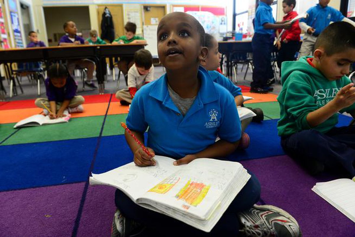 Five-year-old Samatar Abhullahi works during his kindergarten class at Denver's Ashley Elementary School.