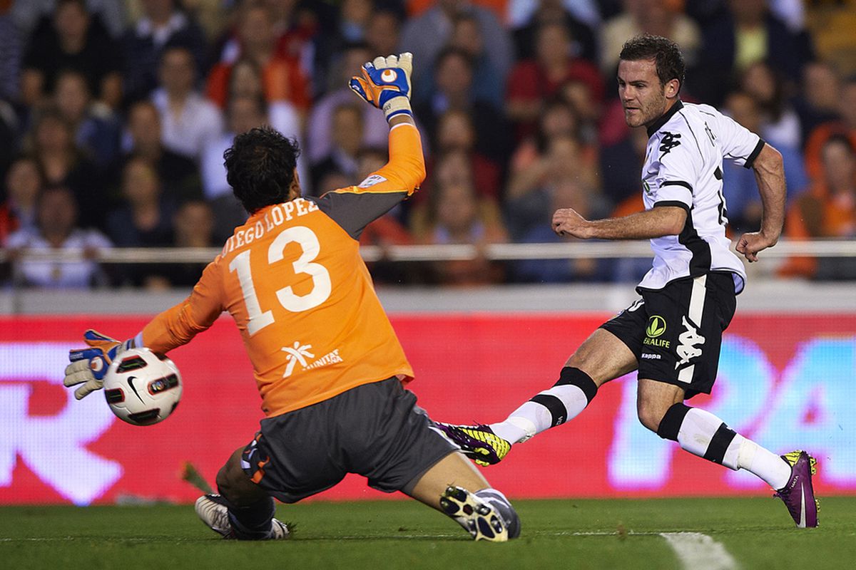 VALENCIA, SPAIN - APRIL 10: Juan Mata of Valencia scores Los Che's second goal   (Photo by Manuel Queimadelos Alonso/Getty Images)