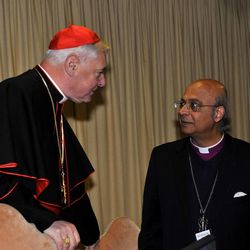 Cardinal Gerhard Mueller, left, and Bishop Michael Nazir’ Ali, Former Anglican Bishop of Rochester at the Colloquium on the Complementarity of Man and Woman, Tuesday, Nov. 18, 2014, in Vatican City.
