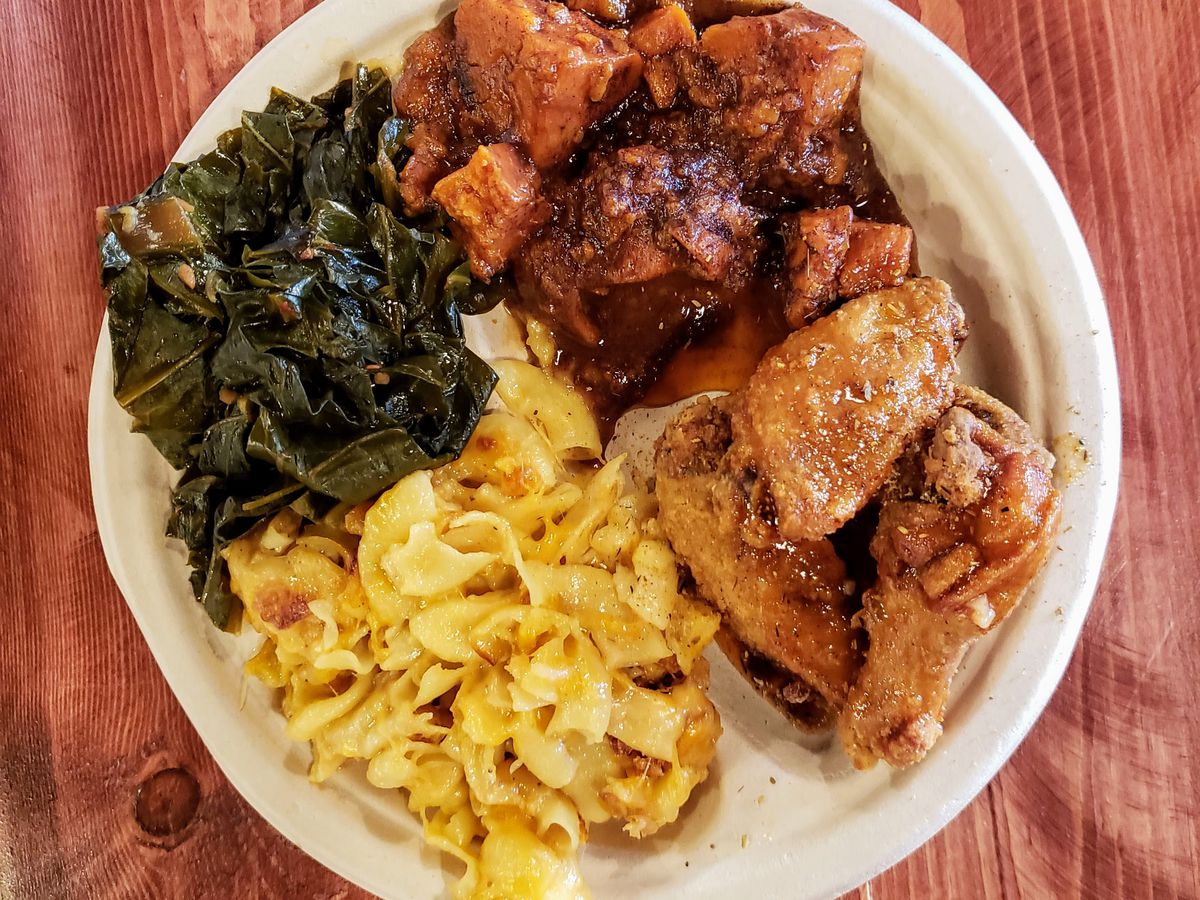 Comfort L.A. platter with mac and cheese, chicken wings, and sweet potatoes