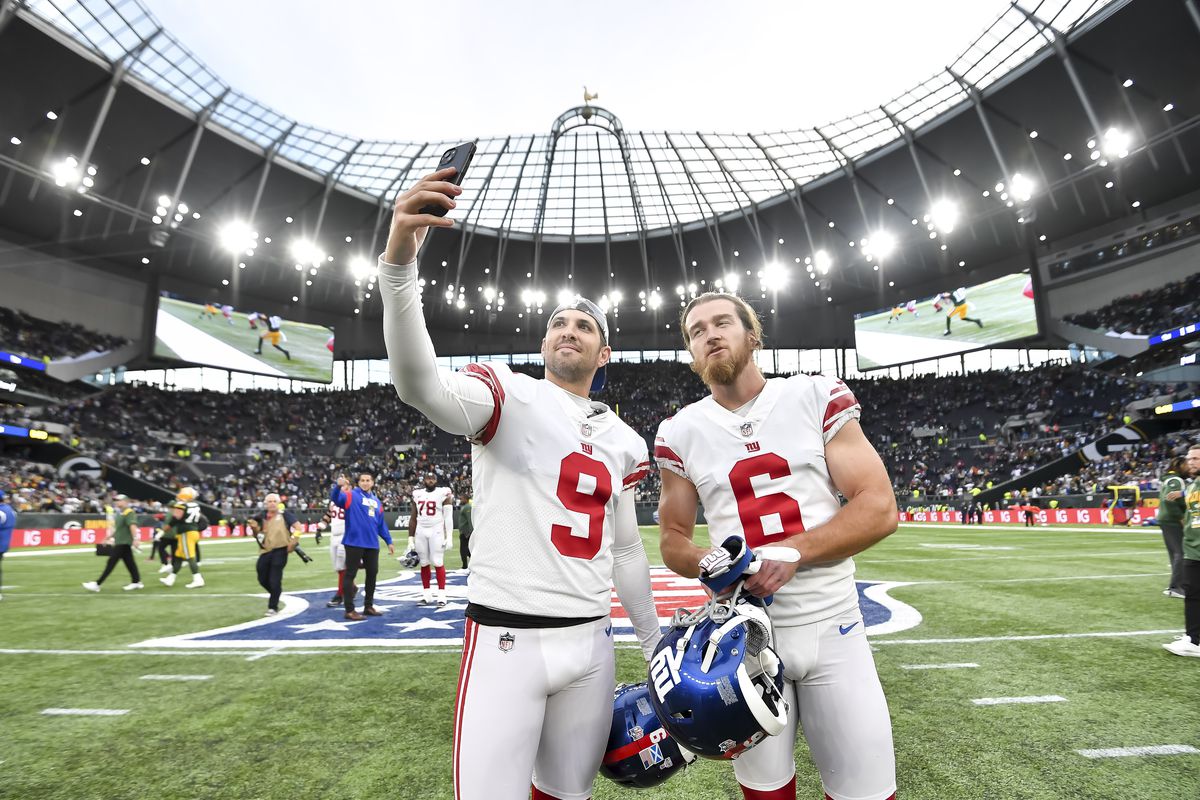 Graham Gano of New York Giants and Jamie Gillan of New York Giants taking a selfie after the NFL match between New York Giants and Green Bay Packers at Tottenham Hotspur Stadium on October 9, 2022 in London, England.