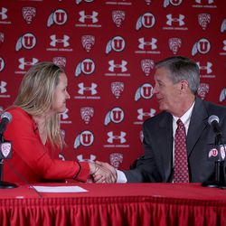 FILE - Lynne Roberts and Dr. Chris Hill, Athletics Director & Special Assistant to the President, shake hands following a press conference at the University of Utah in Salt Lake City on Wednesday, April 29, 2015.  Roberts, the 2014-15 West Coast Conference Co-Coach of the Year, has been named the new head women's basketball coach at the University of Utah.