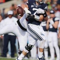 Brigham Young Cougars quarterback Taysom Hill (7) has the ball stripped by Southern Utah Thunderbirds defensive lineman Robert Torgerson (97)  in Provo on Saturday, Nov. 12, 2016.