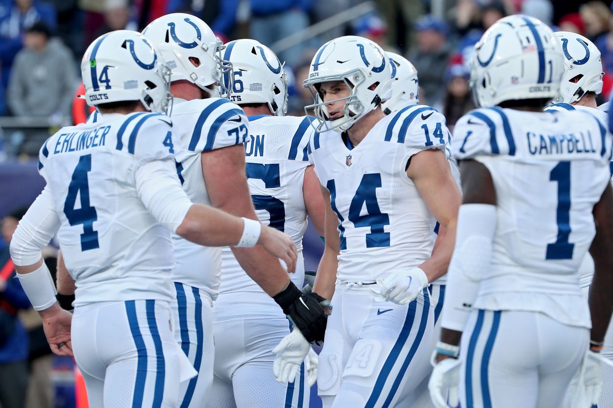 Sam Ehlinger #4 of the Indianapolis Colts celebrates a touchdown with Alec Pierce #14 of the Indianapolis Colts during the fourth quarter against the New England Patriots at MetLife Stadium on January 01, 2023 in East Rutherford, New Jersey.