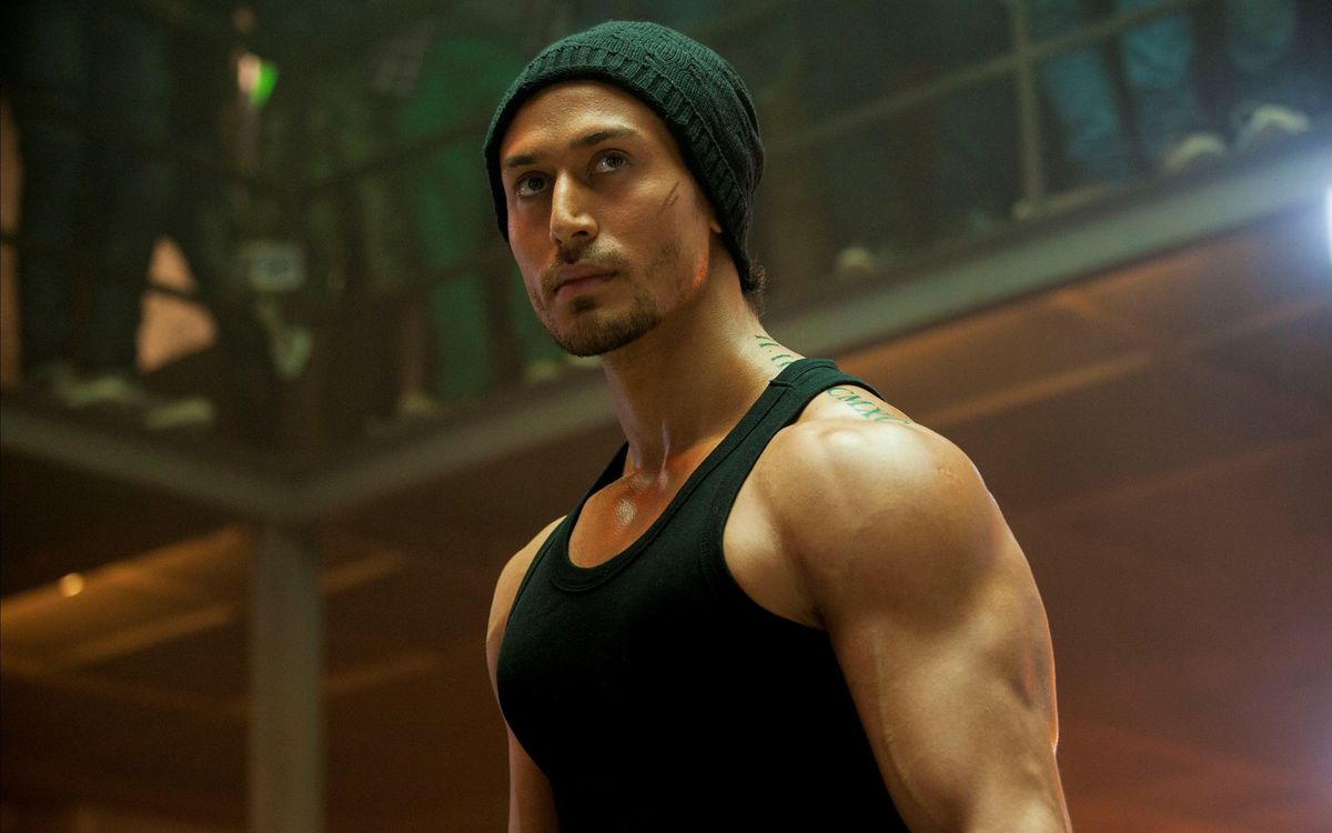Tiger Shroff looking fine as hell in a black tanktop and a beanie in Baaghi