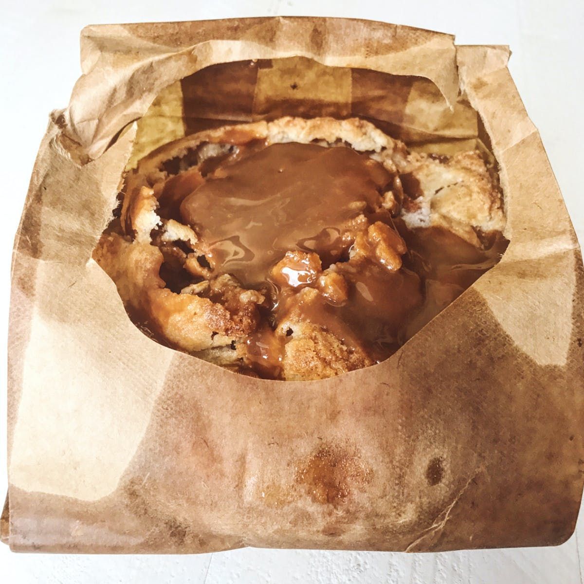 Apple pie inside a brown bag.