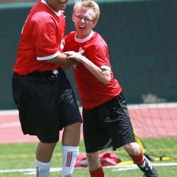 Spanish Fork teammates celebrate a goal during the 2014 Unified Soccer State High School Tournament, hosted by Special Olympics Utah and the Utah High School Activities Association, at Hillcrest High School in Midvale on Saturday, May 3, 2014.