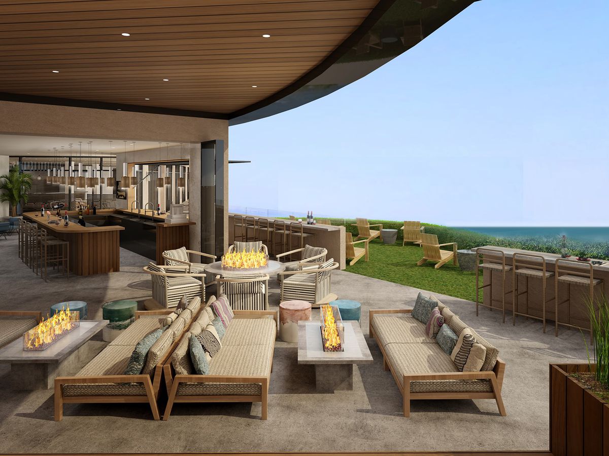 An outdoor lounge area with an ocean view.