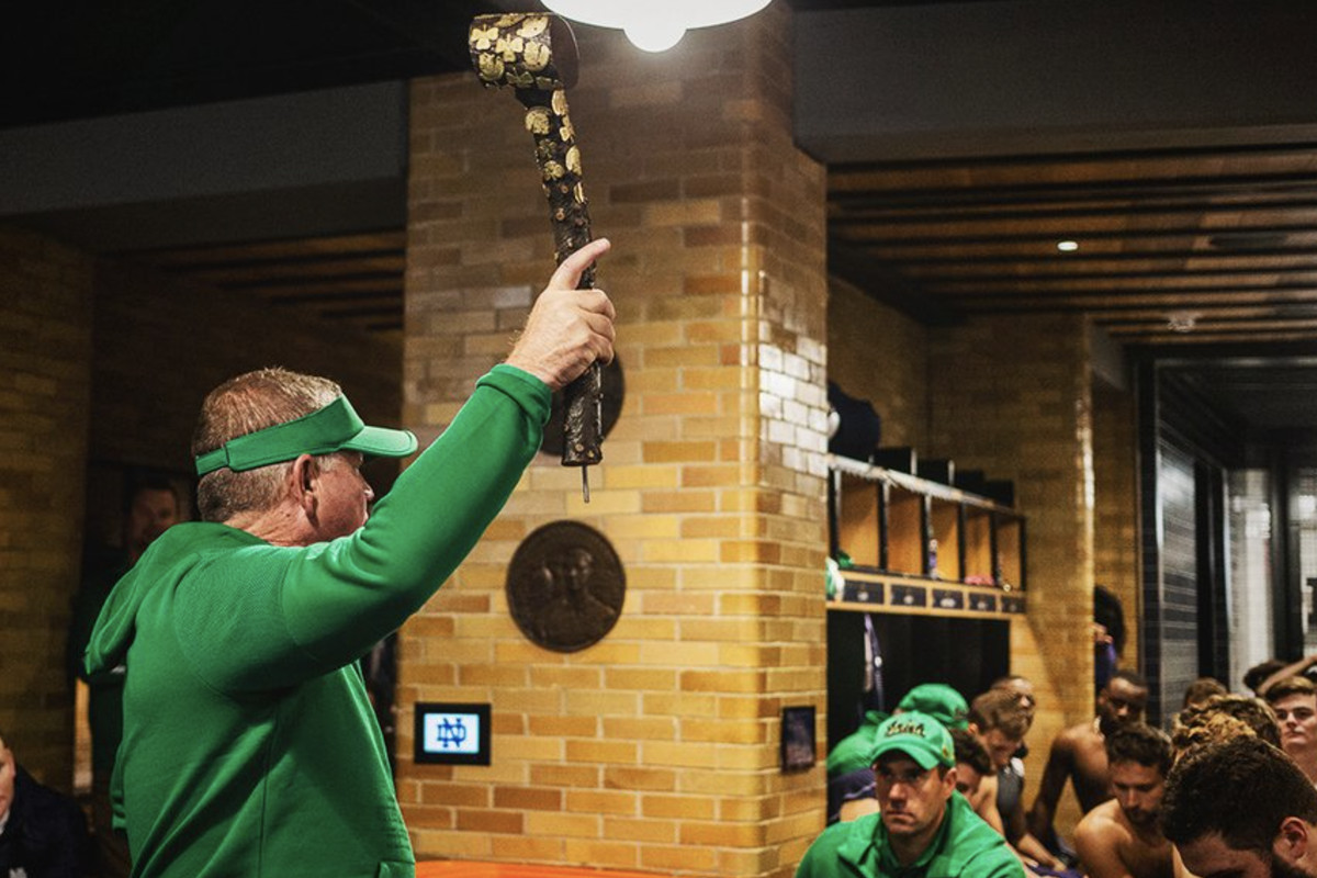 Notre Dame coach Brian Kelly hoists Jeweled Shillelagh after win over USC