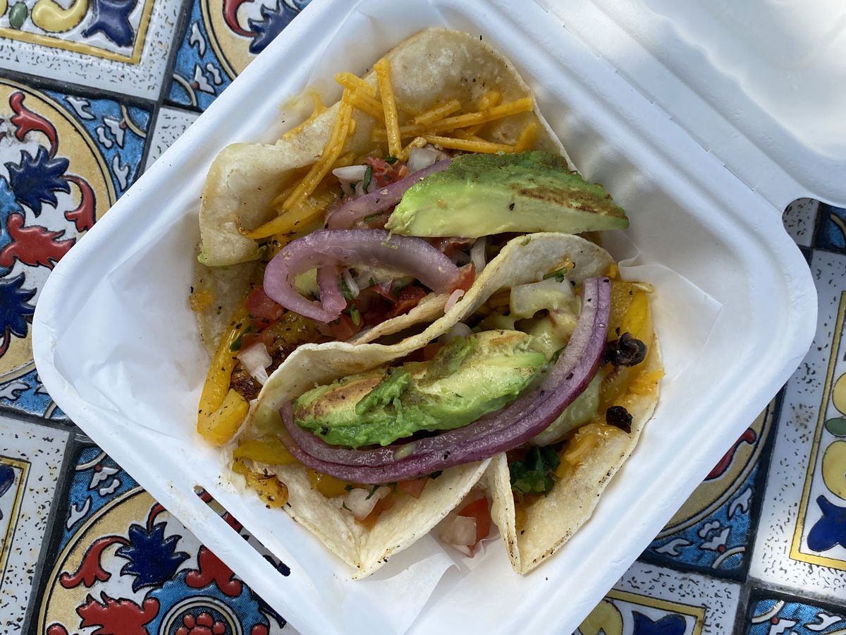 A photo of the vegan tacos with crispy corn tortillas and vegetables from La Osita food cart