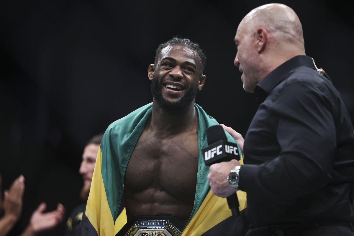 Aljamain Sterling speaks with Joe Rogan during his Octagon interview after defeating Petr Yan at UFC 273. 